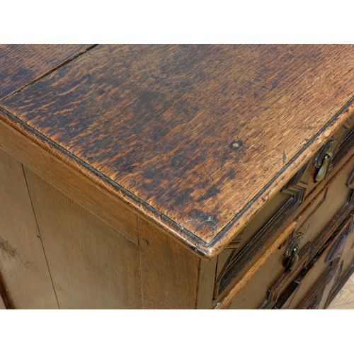 533 - A William III oak chest of drawers, having two short drawers over three graduated long drawers, moul... 