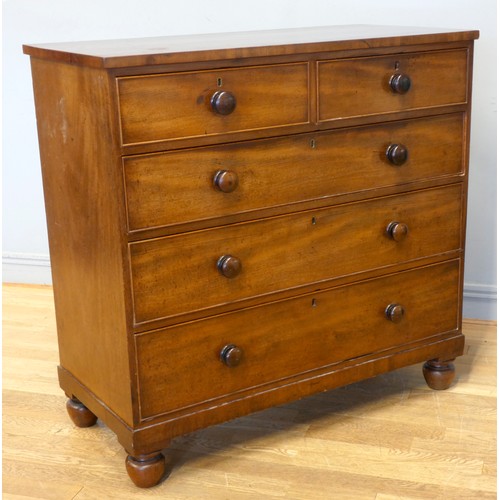 536 - An Edwardian mahogany chest of drawers, having two short over three long drawers, raised on bun feet... 