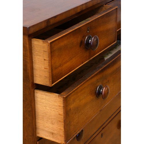 536 - An Edwardian mahogany chest of drawers, having two short over three long drawers, raised on bun feet... 