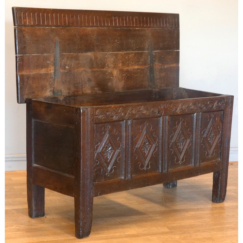 539 - A 17th century and later oak coffer, the rectangular panelled hinged lid with moulded edge, over fou... 