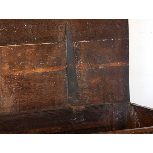 539 - A 17th century and later oak coffer, the rectangular panelled hinged lid with moulded edge, over fou... 