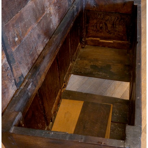 539 - A 17th century and later oak coffer, the rectangular panelled hinged lid with moulded edge, over fou... 