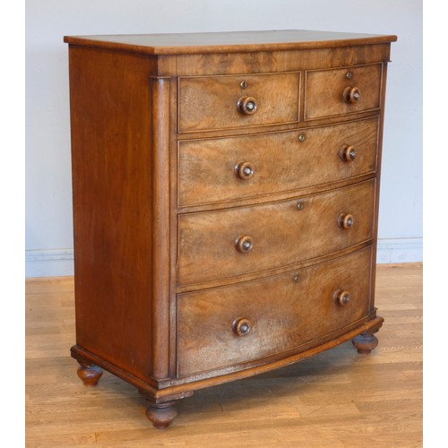 540 - An Edwardian mahogany bow fronted chest of drawers, having two short drawers over three graduated lo... 