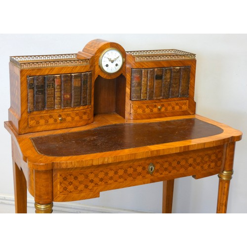 542 - A late 19th century French tulipwood and mahogany parquetry veneered writing table, central 8 day cl... 