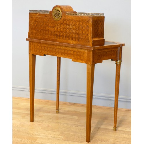 542 - A late 19th century French tulipwood and mahogany parquetry veneered writing table, central 8 day cl... 