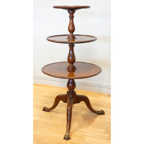 543 - A 19th century three tier circular dumb waiter, the lower two revolving, raised on a tripod base wit... 