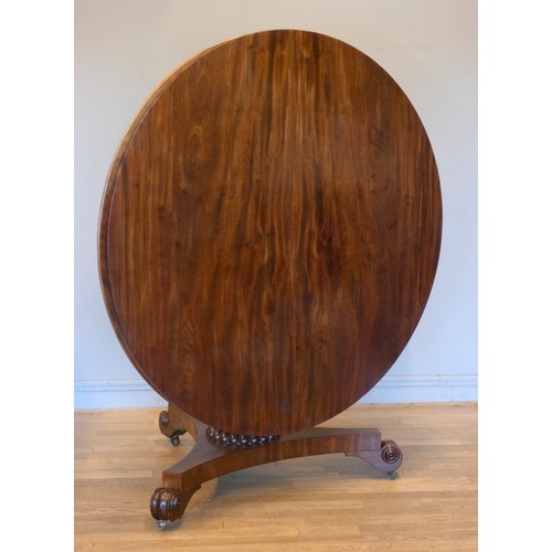 546 - A Victorian mahogany pedestal dining table with circular tilt top supported by a turned column on tr... 