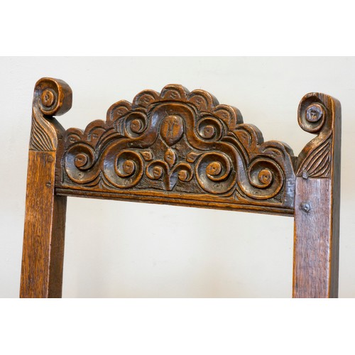 547 - A pair of 18th century oak Yorkshire chairs, the definite back crests with voluted scrolls and centr... 