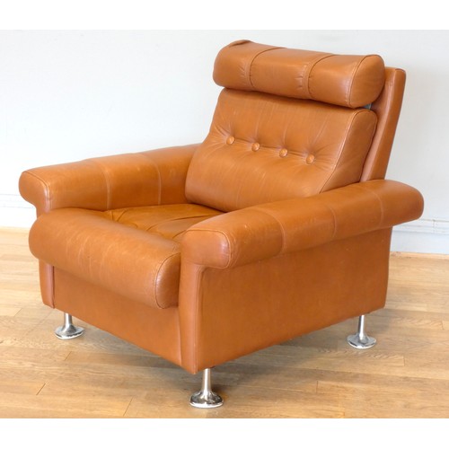 577 - A 1970s tan leather armchair, button back with spayed armrests, raised on chrome feet.
W87, H37 (sea... 