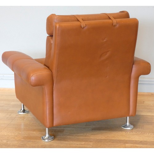 577 - A 1970s tan leather armchair, button back with spayed armrests, raised on chrome feet.
W87, H37 (sea... 