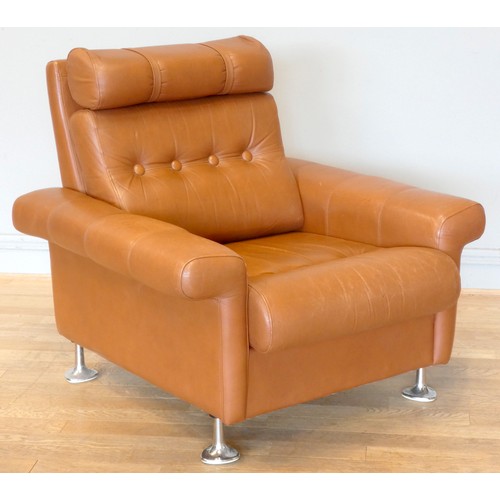 577 - A 1970s tan leather armchair, button back with spayed armrests, raised on chrome feet.
W87, H37 (sea... 