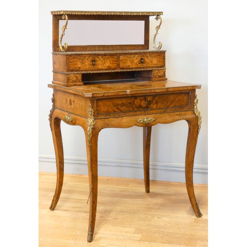 548 - A late 19th century French burr walnut and stained fruitwood writing table, with ormolu mounts, the ... 