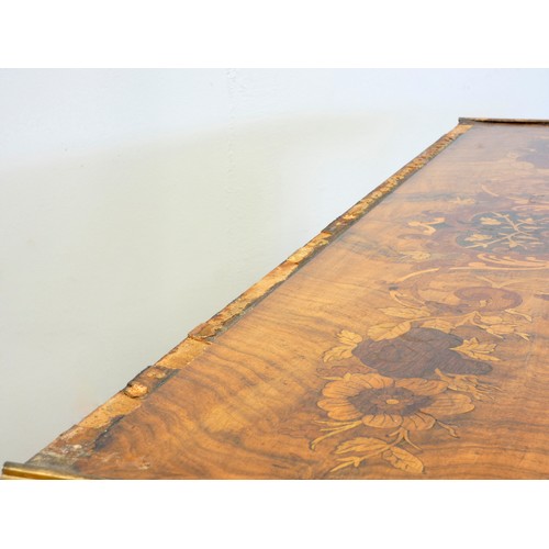 548 - A late 19th century French burr walnut and stained fruitwood writing table, with ormolu mounts, the ... 