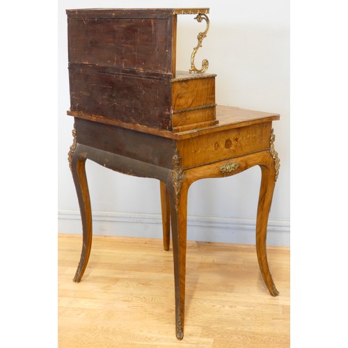 548 - A late 19th century French burr walnut and stained fruitwood writing table, with ormolu mounts, the ... 