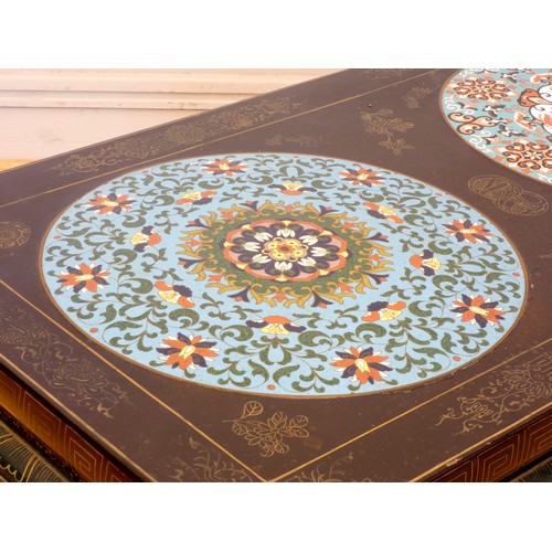 550 - A Japanese black lacquer and cloisonne low table, composed of three slightly domed panels, the whole... 