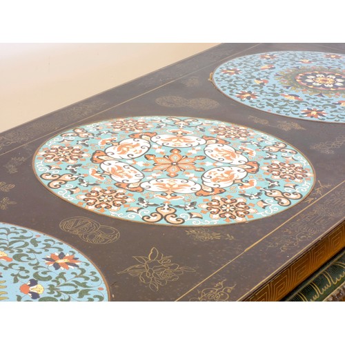 550 - A Japanese black lacquer and cloisonne low table, composed of three slightly domed panels, the whole... 