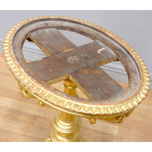 551 - A giltwood and marble oval occasional table, raised on a tripod pedestal, 56 x 43 x 72cm