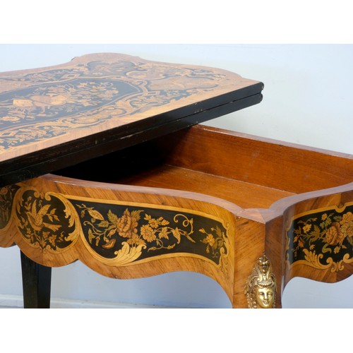 553 - A 19th century French serpentine kingwood and mahogany fold over card table, the ebony and stained f... 