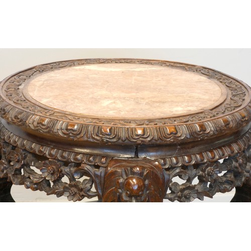 555 - A 19th century Chinese hardwood and marble circular occasional table, with pierced floral frieze, 46... 