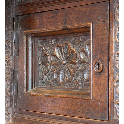 563 - Charles II and later oak press or court cupboard, dated 1688, the canopy top with inverted finials a... 