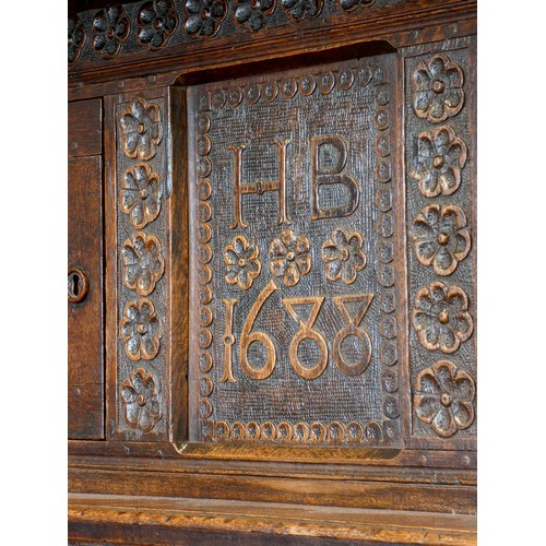 563 - Charles II and later oak press or court cupboard, dated 1688, the canopy top with inverted finials a... 