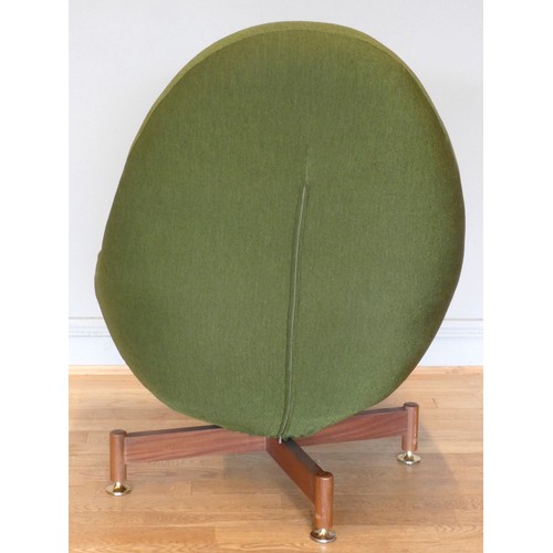 573 - A swivel egg chair by Greaves & Thomas, c.1960s, the moulded shell, upholstered in a sage green cott... 