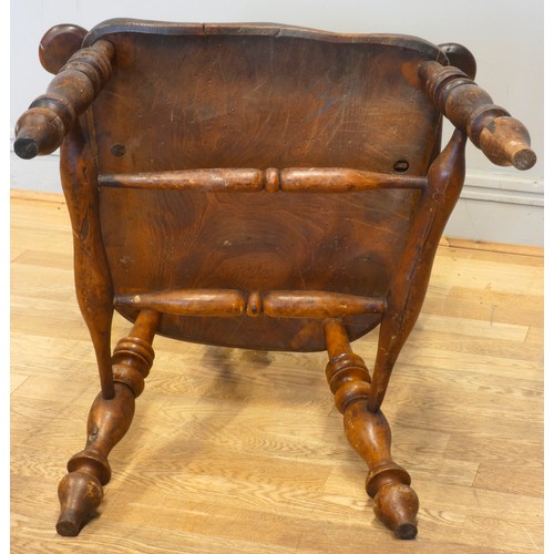 564 - A 19th century elm and yew wood hoop back Windsor chair, the stick back centred with a pierced splat... 