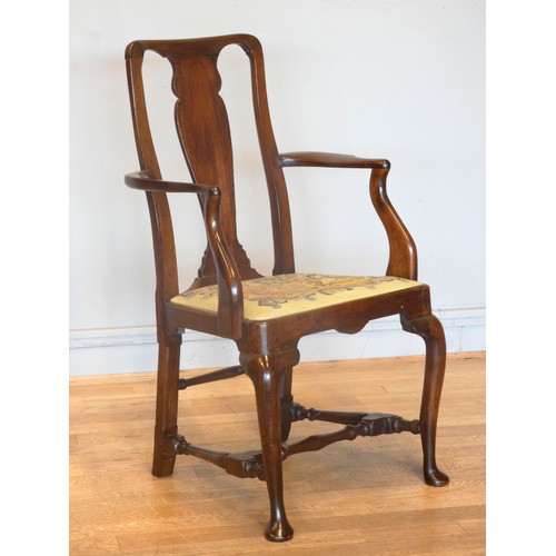 558 - A Georgian mahogany armchair, with shepherd crook arms and vasiform splat beneath a yoke crest rail,... 