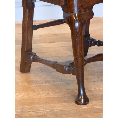 558 - A Georgian mahogany armchair, with shepherd crook arms and vasiform splat beneath a yoke crest rail,... 