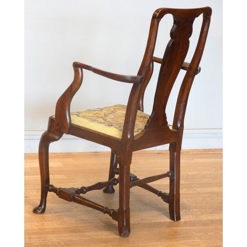 558 - A Georgian mahogany armchair, with shepherd crook arms and vasiform splat beneath a yoke crest rail,... 