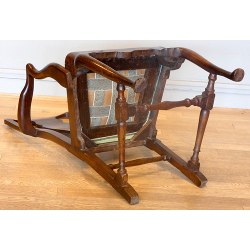 558 - A Georgian mahogany armchair, with shepherd crook arms and vasiform splat beneath a yoke crest rail,... 