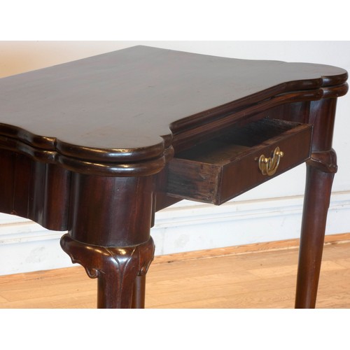 557 - A Georgian mahogany fold over side/card table, of rectangular form with projecting turret corners, c... 