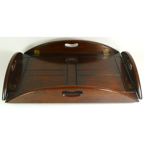 531 - A 19th century mahogany butlers tray, having panelled centre with reeded curved drop down sides. 68 ... 