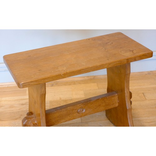 566 - An Alan 'Acornman' Grainger of Bransby, oak stool  having an azed top with carved acorn signature. W... 