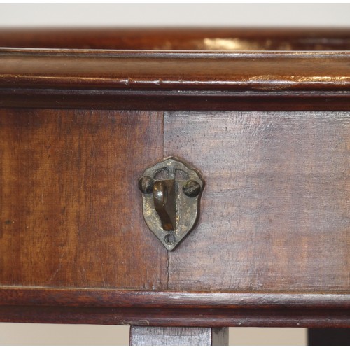 532 - A Victorian mahogany bijouterie stand, the circular top above lower galleried shelf on square brass ... 