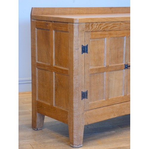 570 - A Peter 'Rabbitman' Heap of Wetwang oak panelled sideboard, with raised upstand above two cupboard d... 