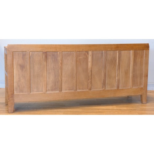 570 - A Peter 'Rabbitman' Heap of Wetwang oak panelled sideboard, with raised upstand above two cupboard d... 