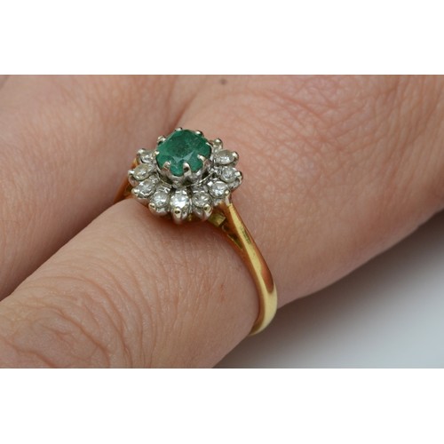 97 - An 18ct gold emerald and diamond cluster ring, London 1976, L 1/2, 4.1gm