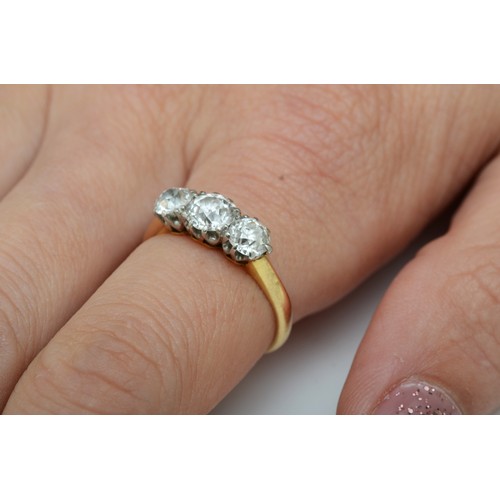 158 - An Edwardian three stone diamond ring, claw set with old cut brilliant stones, weighing approximatel... 