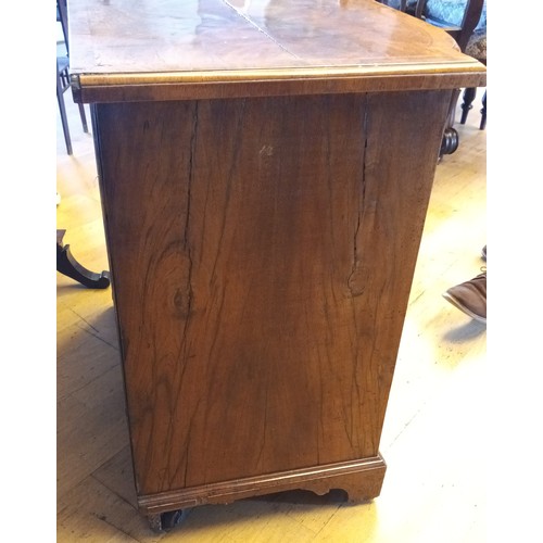 530 - A George II walnut kneehole desk, burrbanded quarter-veneered shaped top with moulded edge above bru... 