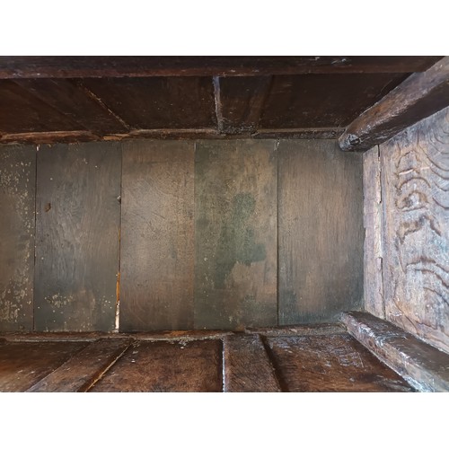 539 - A 17th century and later oak coffer, the rectangular panelled hinged lid with moulded edge, over fou... 