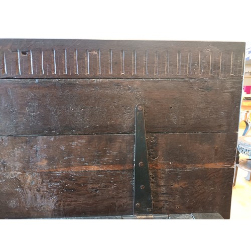 539 - A 17th century and later oak coffer, the rectangular panelled hinged lid with moulded edge, over fou... 