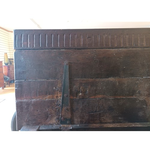 539 - A 17th century and later oak coffer, the rectangular panelled hinged lid with moulded edge, over fou... 