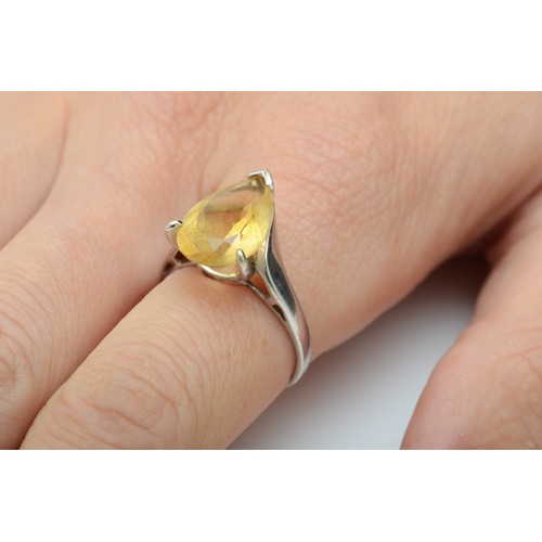 105 - A 9ct white gold single stone citrine ring, claw set with a pear shape stone, 15 x 10mm, N, 3.6gm