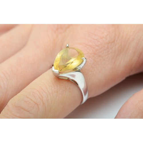 105 - A 9ct white gold single stone citrine ring, claw set with a pear shape stone, 15 x 10mm, N, 3.6gm