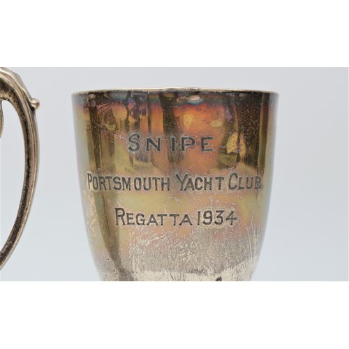 12 - Portsmouth Yacht Club interest; a silver trophy cup, Snipe, 1934, 8.5cm and R.S.Y.C. 16ft Skiff 1950... 