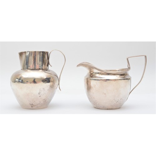 15 - A Victorian silver cream jug, Birmingham 1896, with reeded handle, 7.5cm and another silver cream ju... 