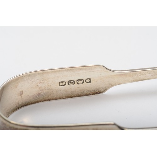 22 - A George III silver fiddle pattern pair of sugar tongs, London 1818, another pair 1831, a mustard sp... 