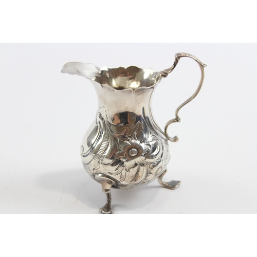 26 - A George III silver embossed cream jug, London 1763, 9.5cm, 69gm