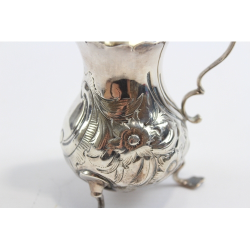 26 - A George III silver embossed cream jug, London 1763, 9.5cm, 69gm